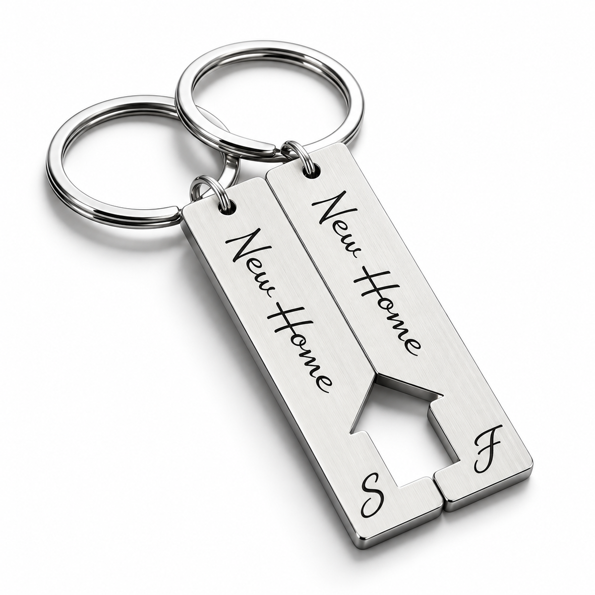 Matching silver new home keychain set with a house cut-out and initials
