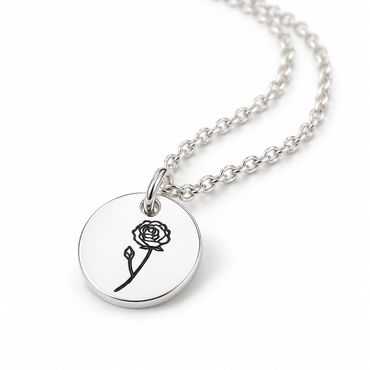 Silver birth flower disc necklace with an engraved June rose on a round disc pendant