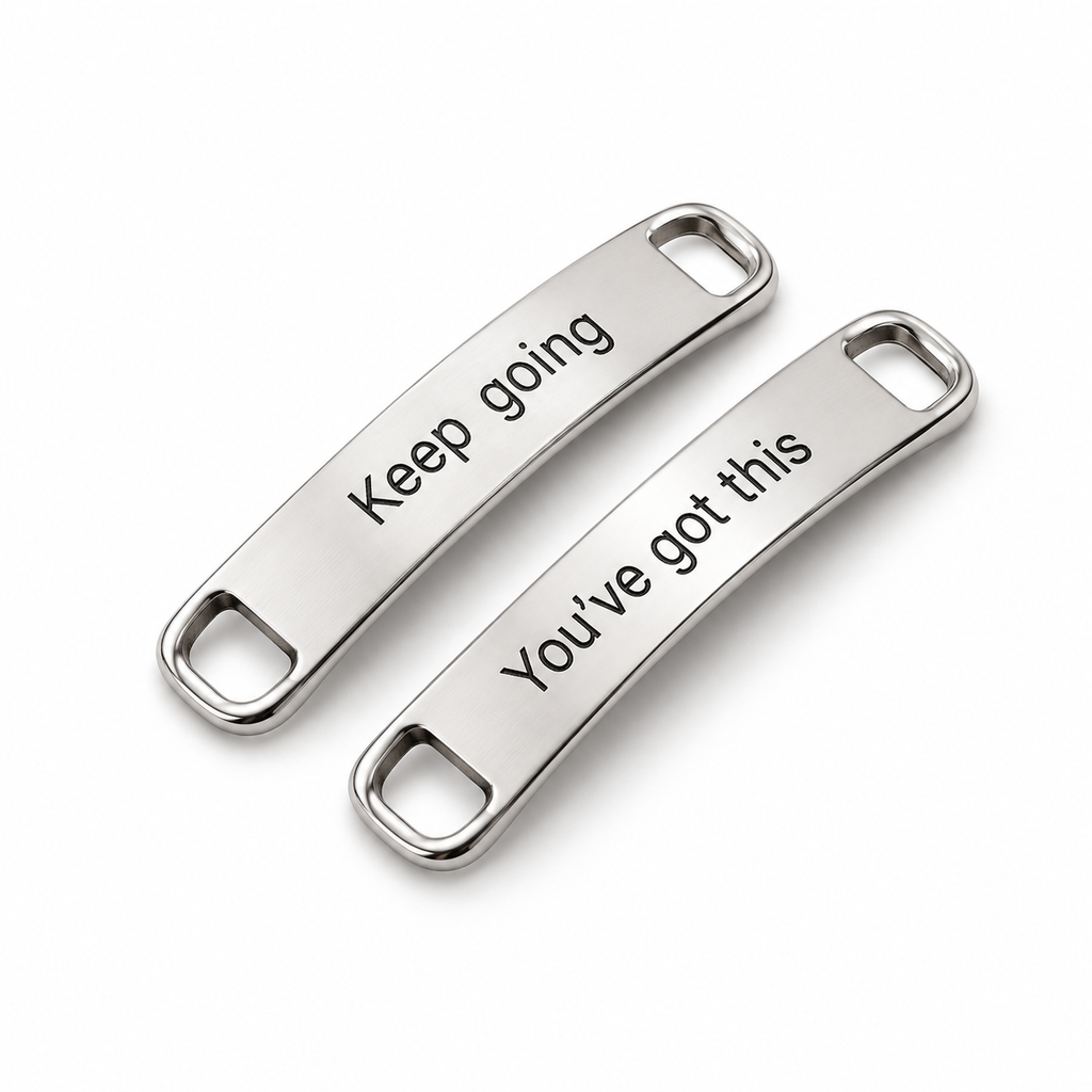Pair of silver shoe lace tags engraved Keep going and You've got this