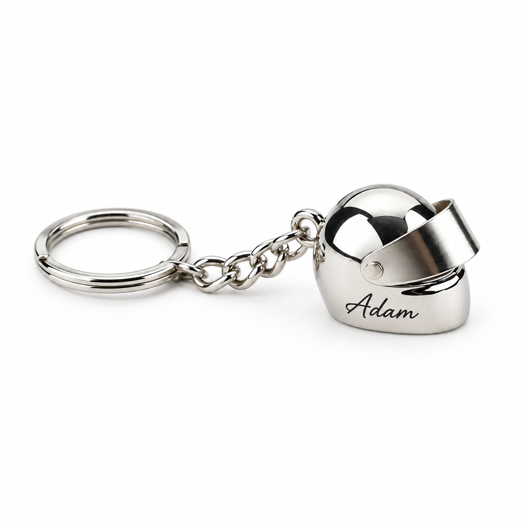 Personalised mini motorcycle helmet keychain in polished silver engraved with a name