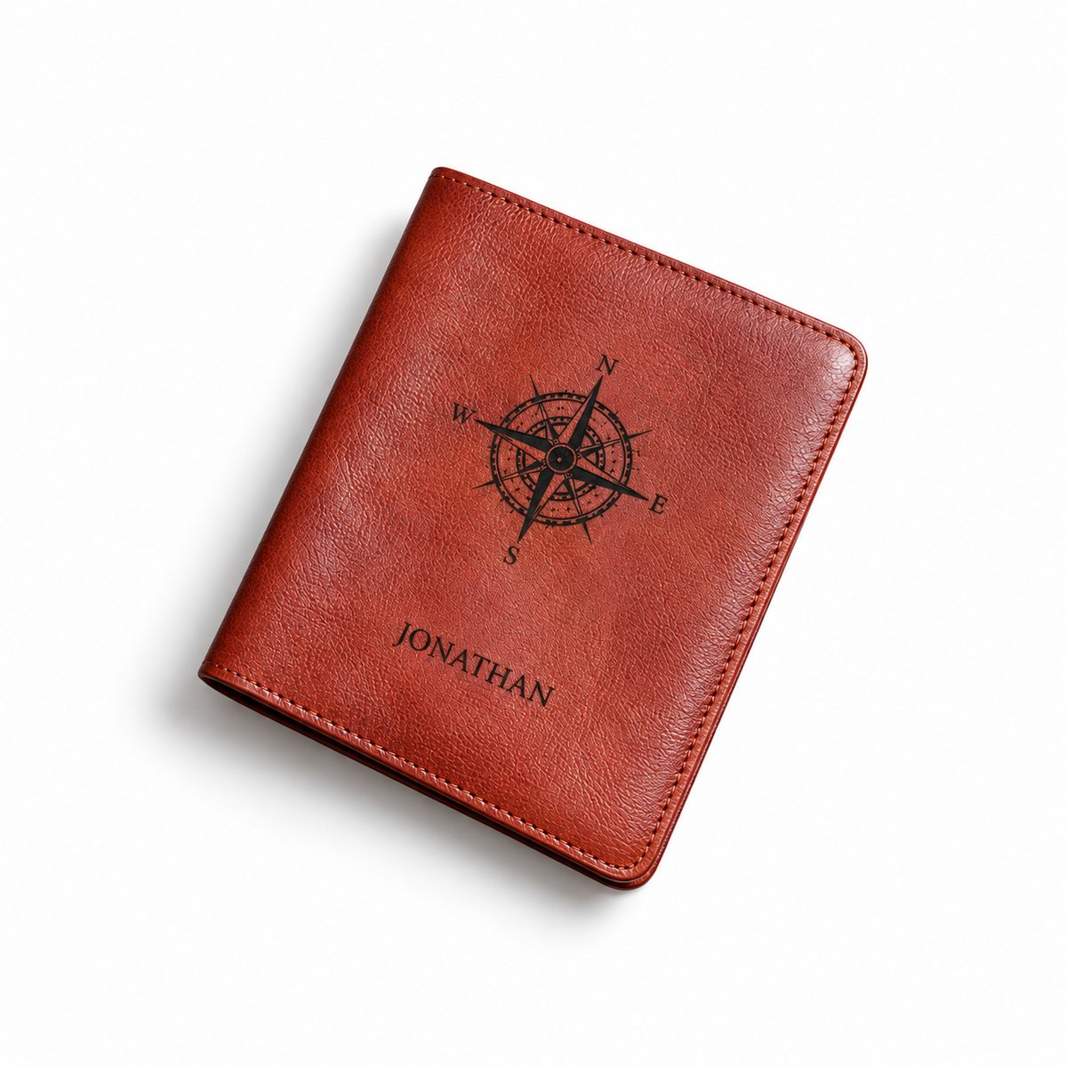 Personalised red-brown leather passport holder with compass and name