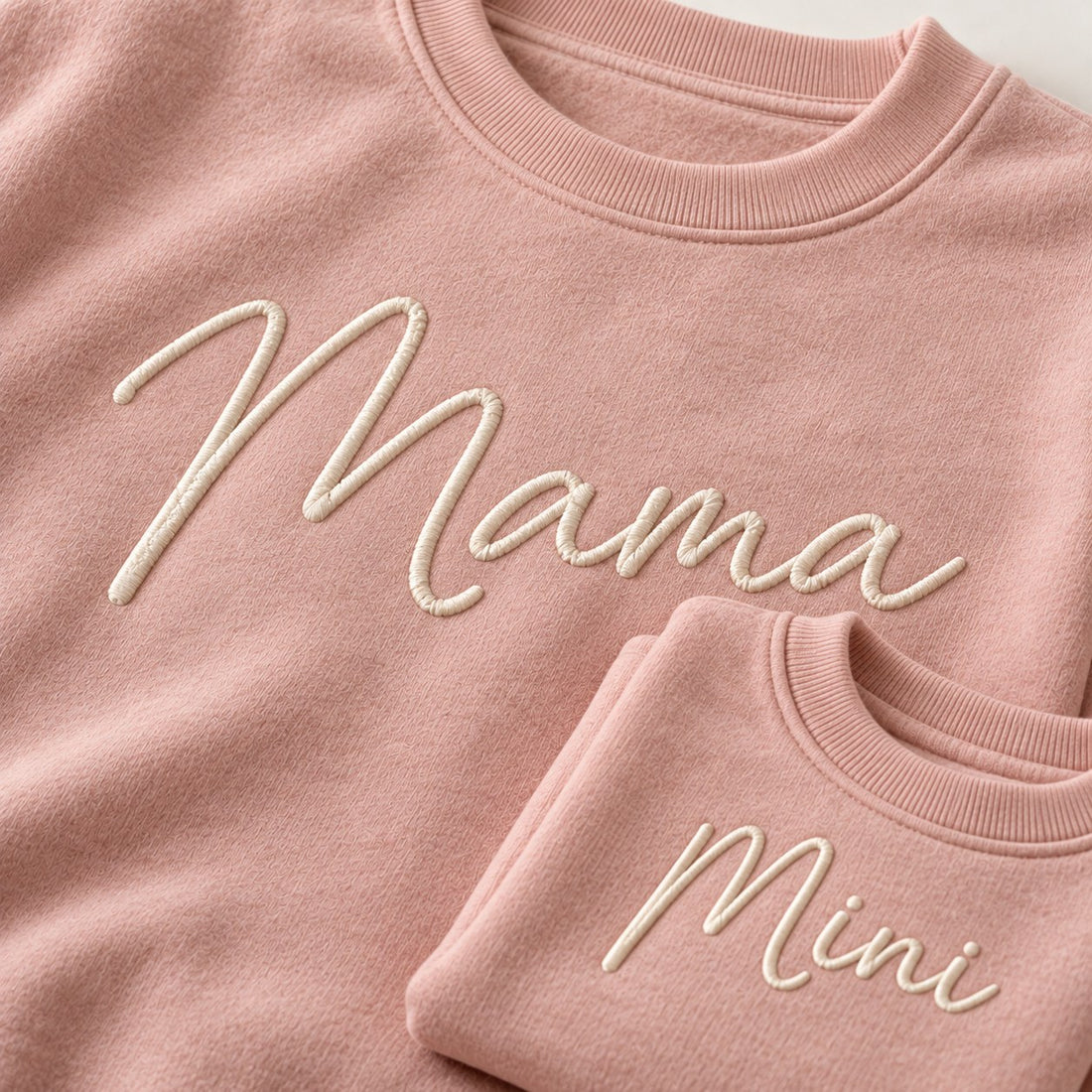 Close-up of embroidered-look Mama and Mini script on matching sweatshirts