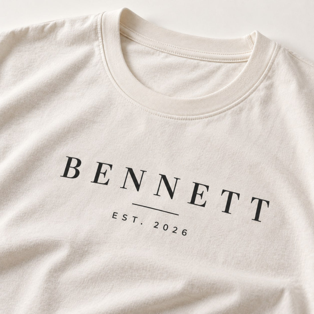 Close-up of a custom family surname t-shirt print with Est. 2026