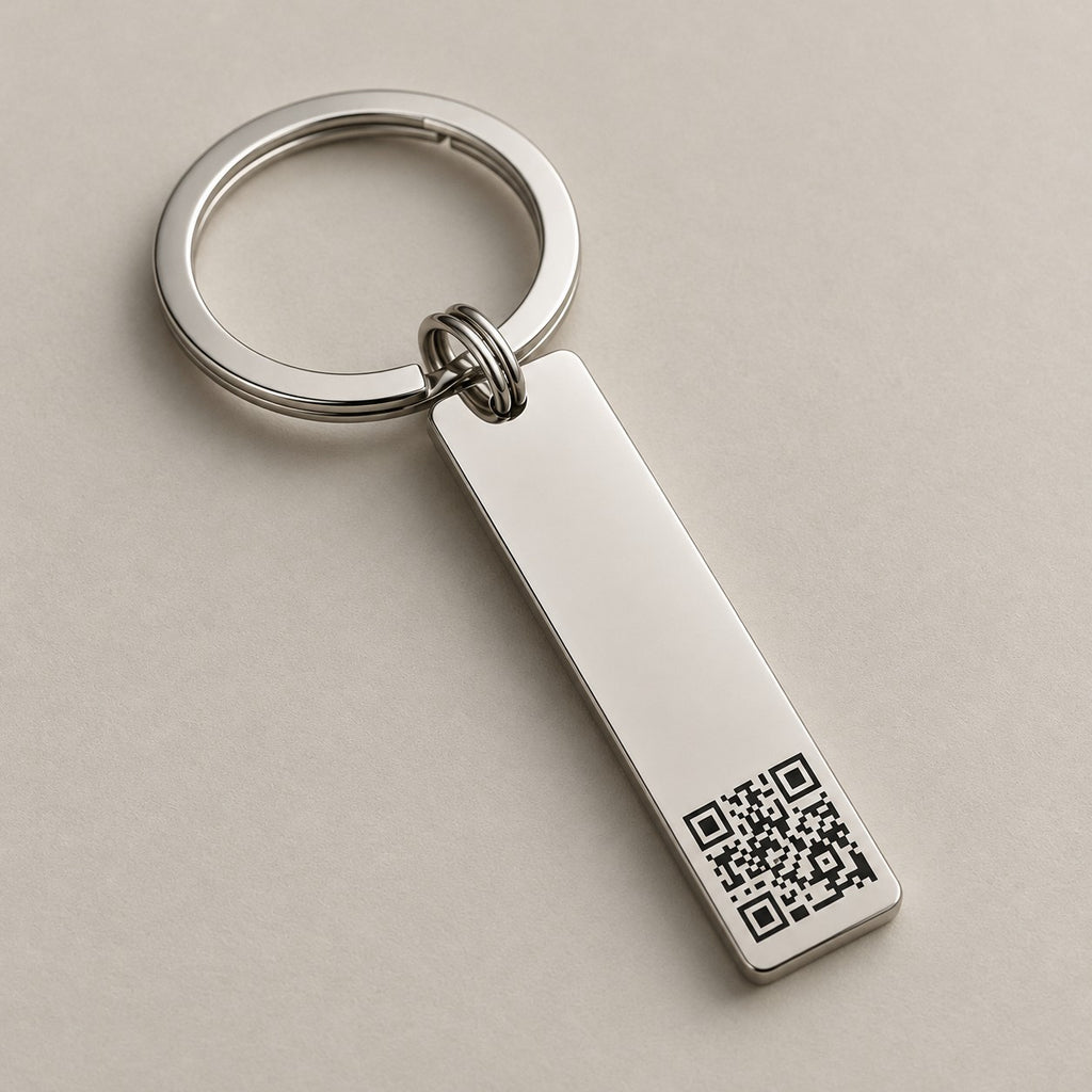Personalised QR code bar keychain on a greige surface