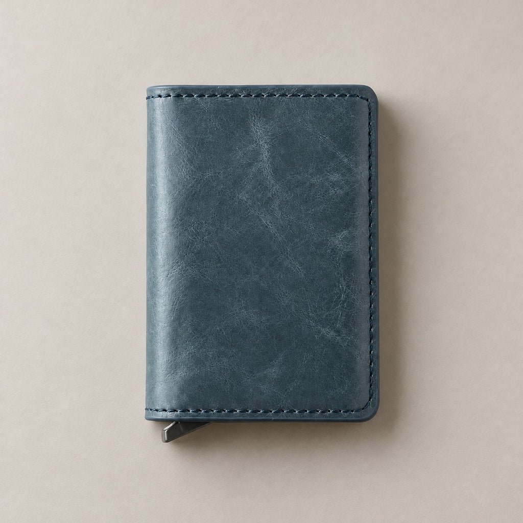 Personalised blue leather pop-up wallet on a greige surface