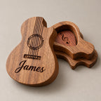 Customised wooden guitar pick box on a greige surface