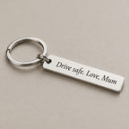 Customised engraved keychain on a greige surface
