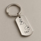 Customised country keychain on a greige surface