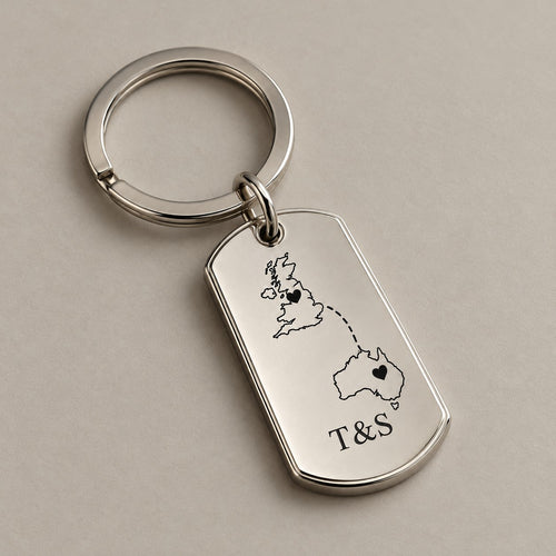Customised country keychain on a greige surface