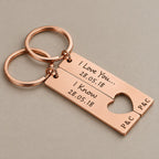 Engraved heart keychain set on a greige surface