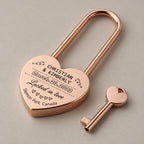 Personalised heart love lock with key on a greige surface