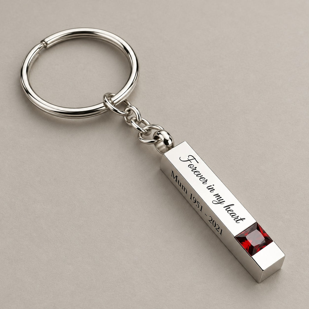 Personalised birthstone bar keychain on a greige surface