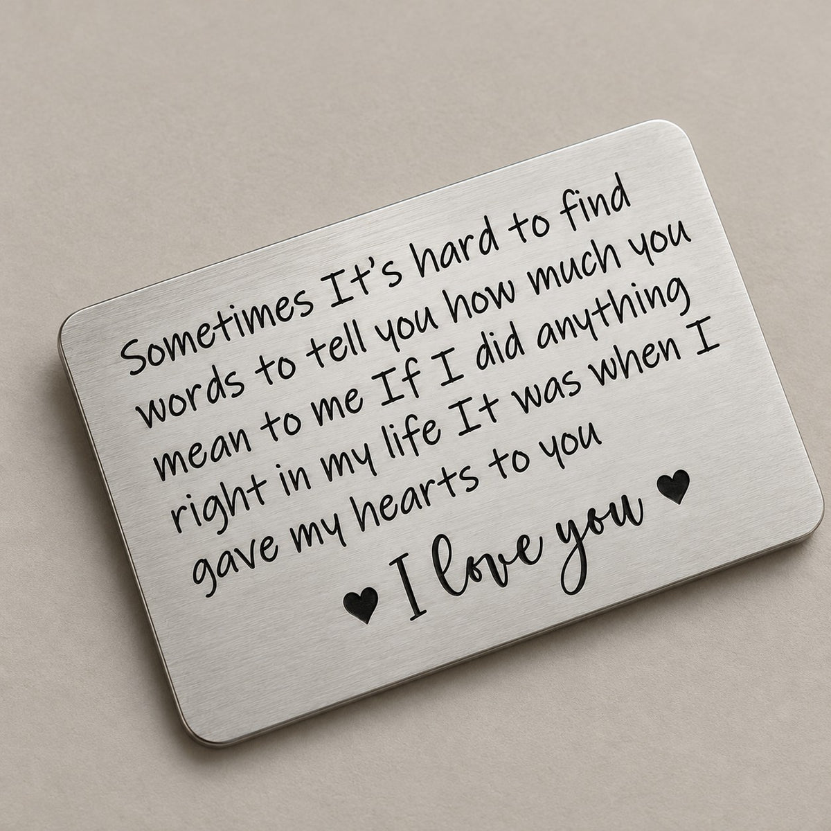 Personalised wallet card on a greige surface