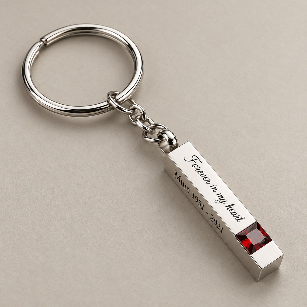 Personalised birthstone bar keychain on a greige surface
