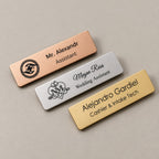 Personalised name badges on a greige surface