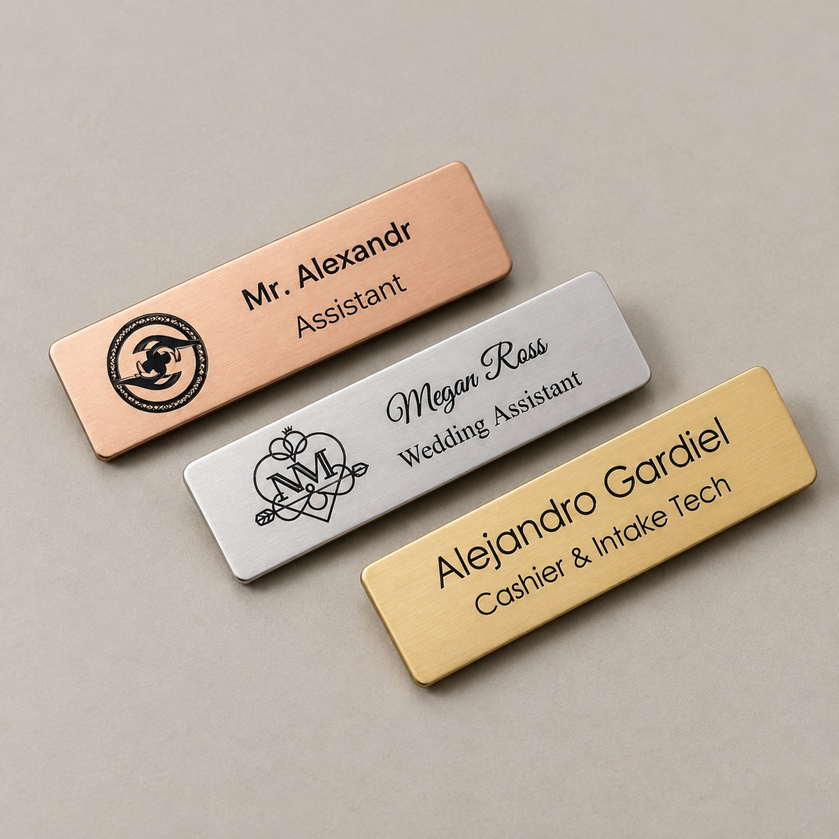 Personalised name badges on a greige surface