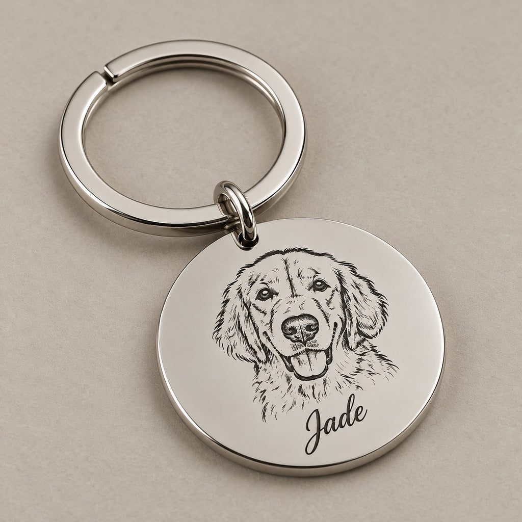 Engraved pet portrait keychain on a greige surface