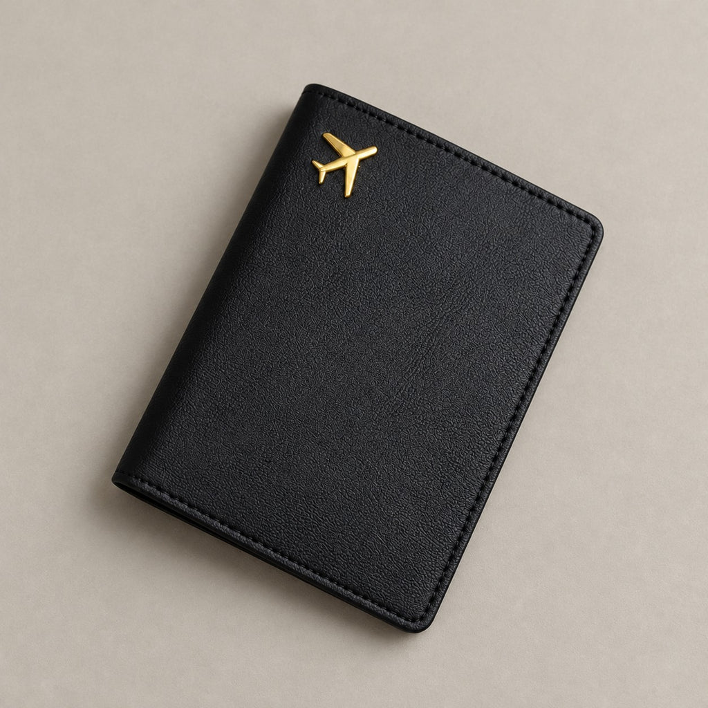 Personalised black leather passport holder on a greige surface