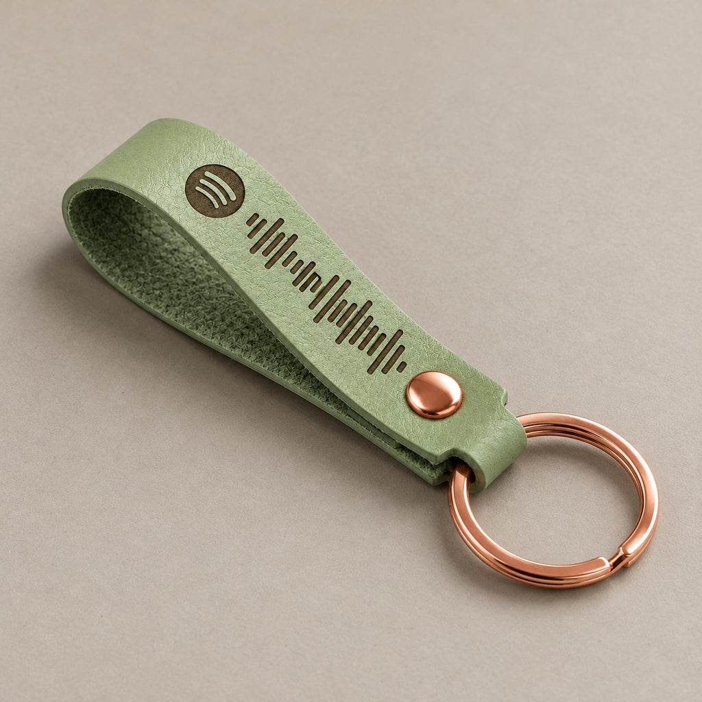 Customised leather keyring on a greige surface