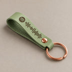 Customised leather keyring on a greige surface
