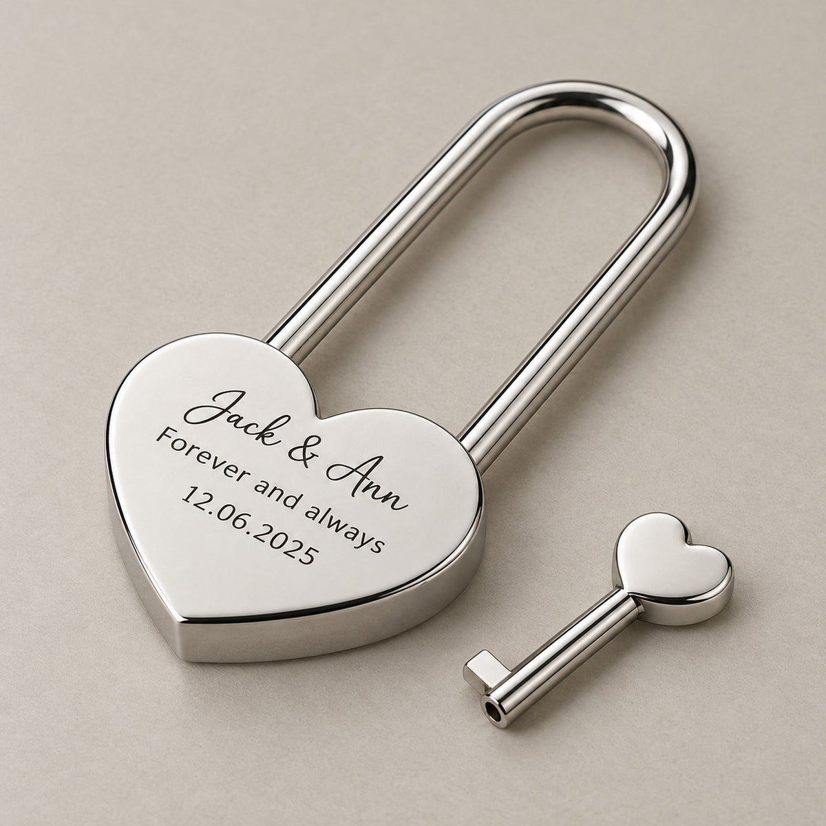 Engraved heart love lock on a greige surface