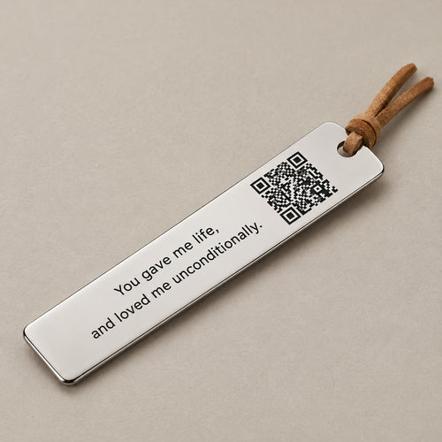 Customised QR bookmark on a greige surface