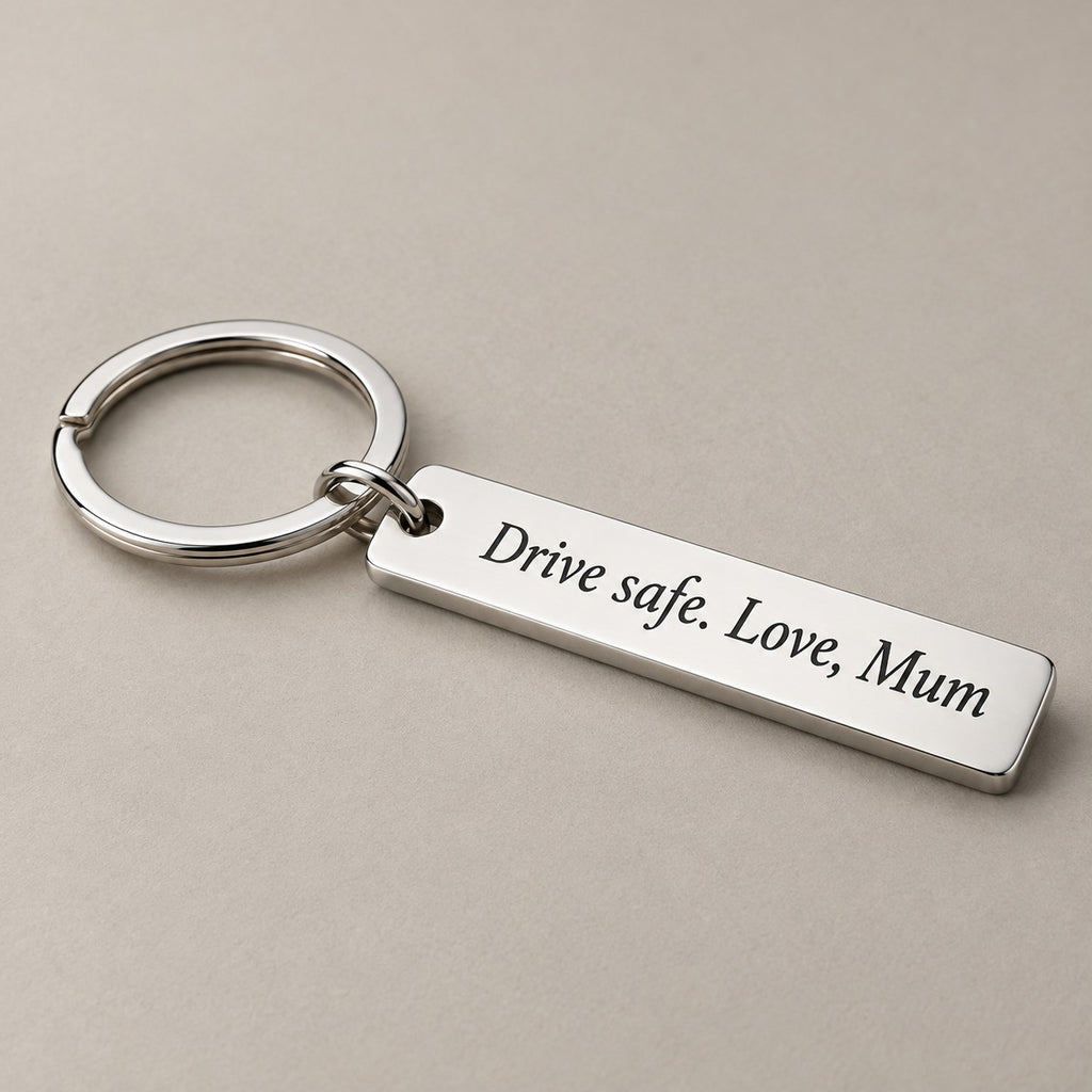 Customised engraved keychain on a greige surface