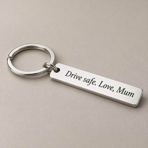 Customised engraved keychain on a greige surface