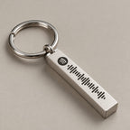 Spotify scannable bar keyring on a neutral surface