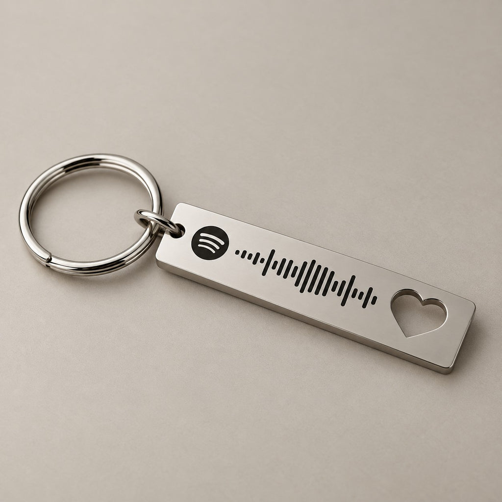 Heart-cut Spotify keyring on a neutral surface