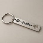 Heart-cut Spotify keyring on a neutral surface