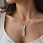 Personalised Spotify bar necklace worn around the neck