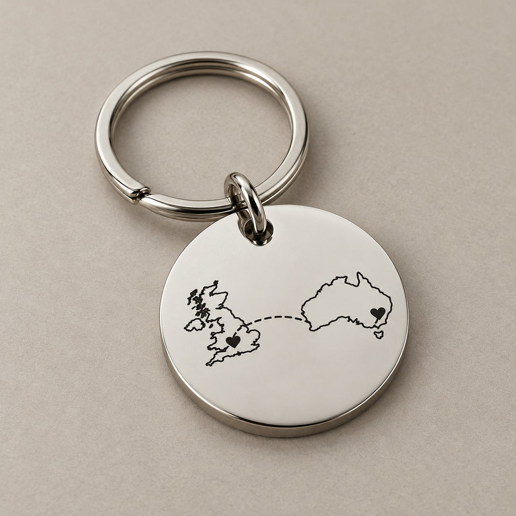Personalised country keychain on a greige surface