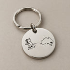 Personalised country keychain on a greige surface