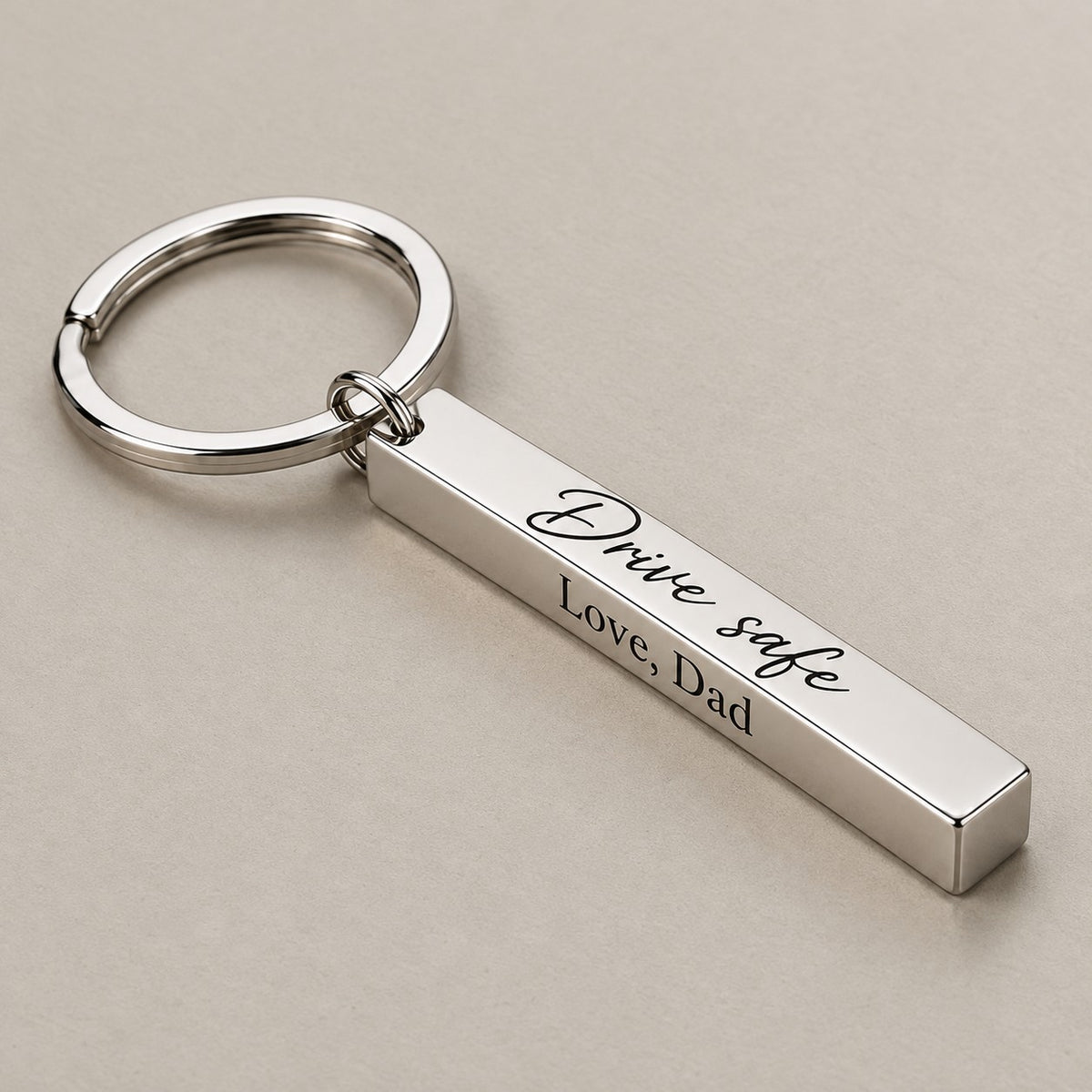 Personalised bar keychain on a greige surface