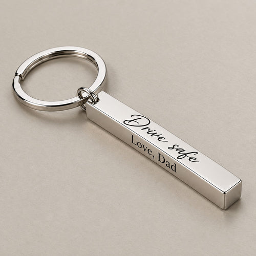 Personalised bar keychain on a greige surface