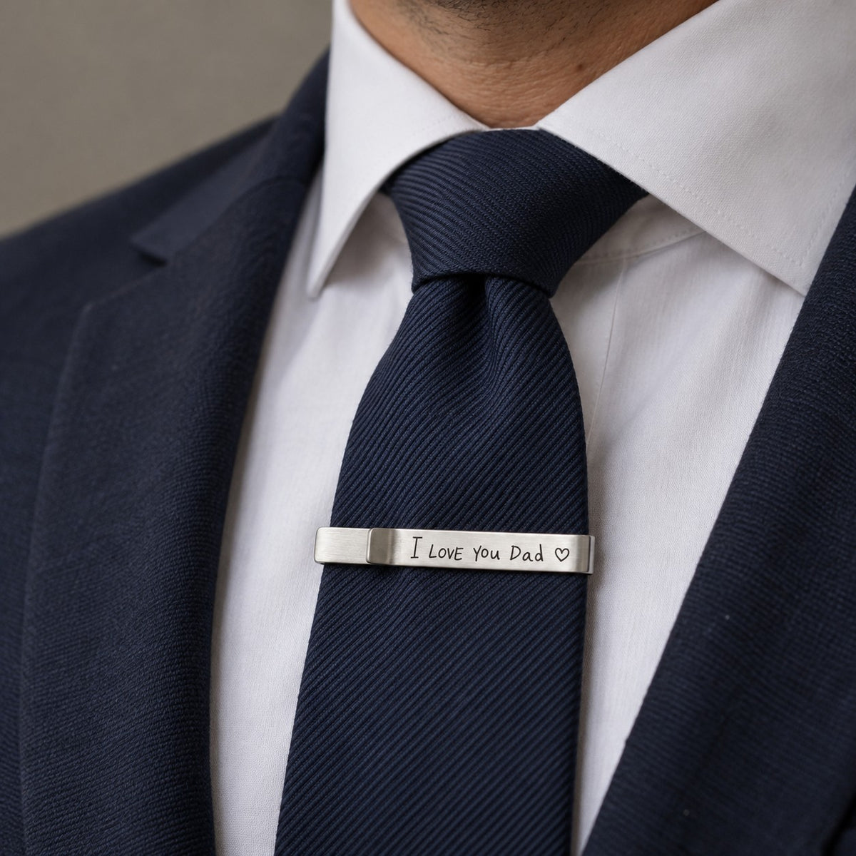 Custom Signature Handwriting Tie Bar worn on a navy tie